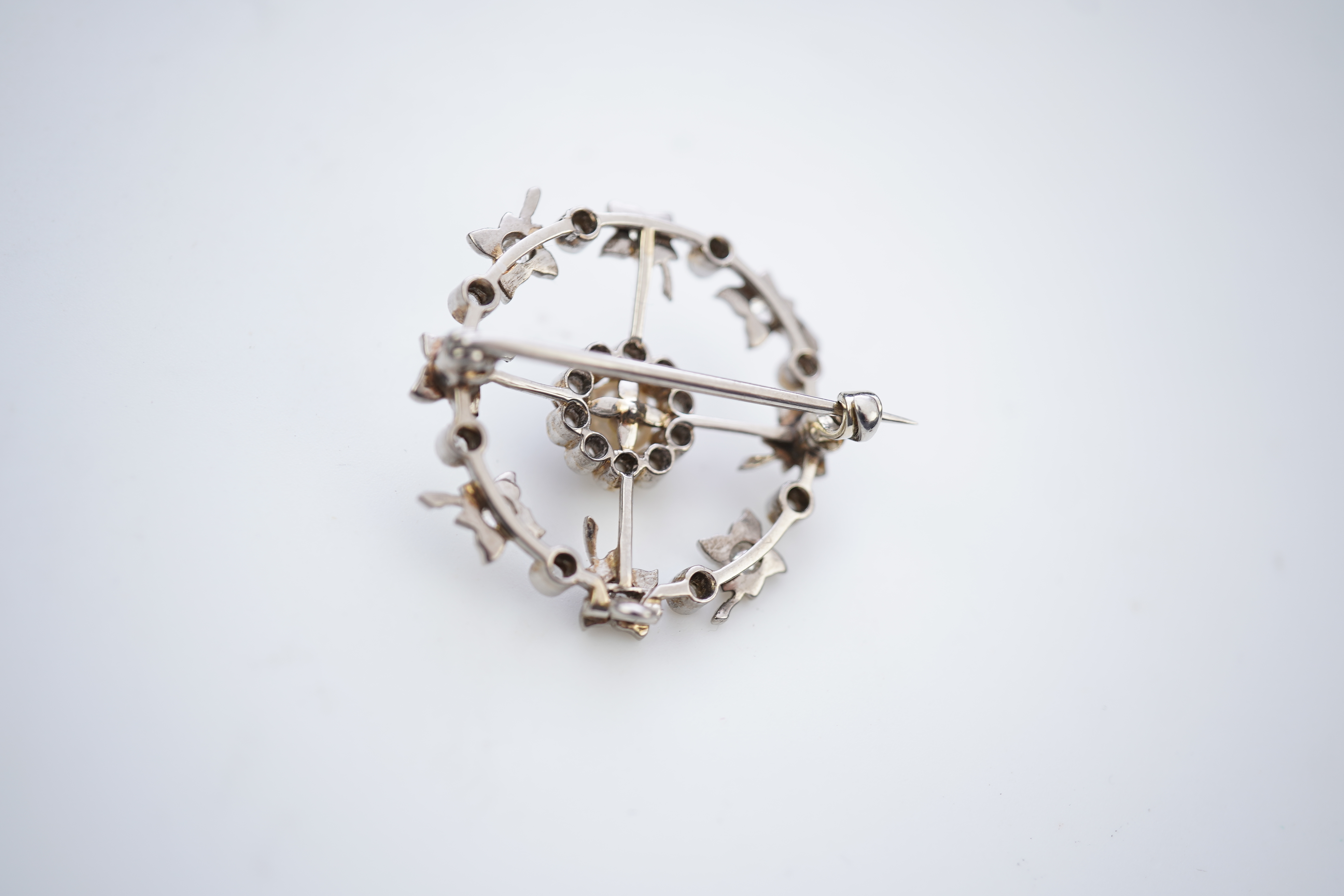 An attractive Edwardian pearl and diamond brooch, circa 1910